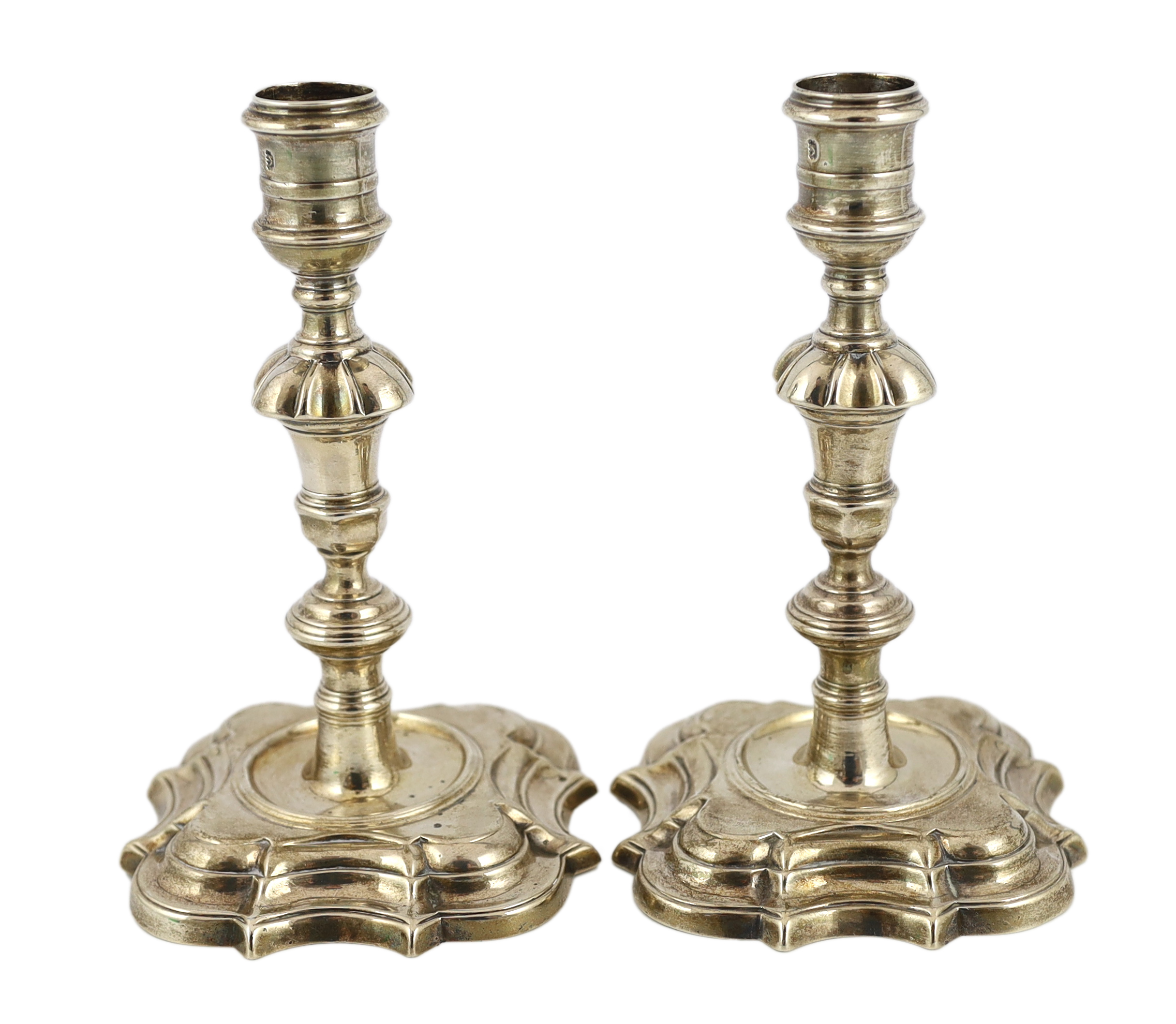 A pair of George II cast silver candlesticks, by Richard Gosling